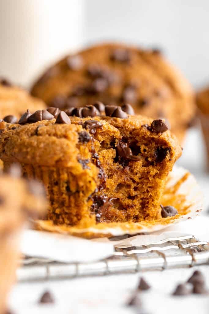 Pumpkin chocolate chip muffins on a cooling rack.