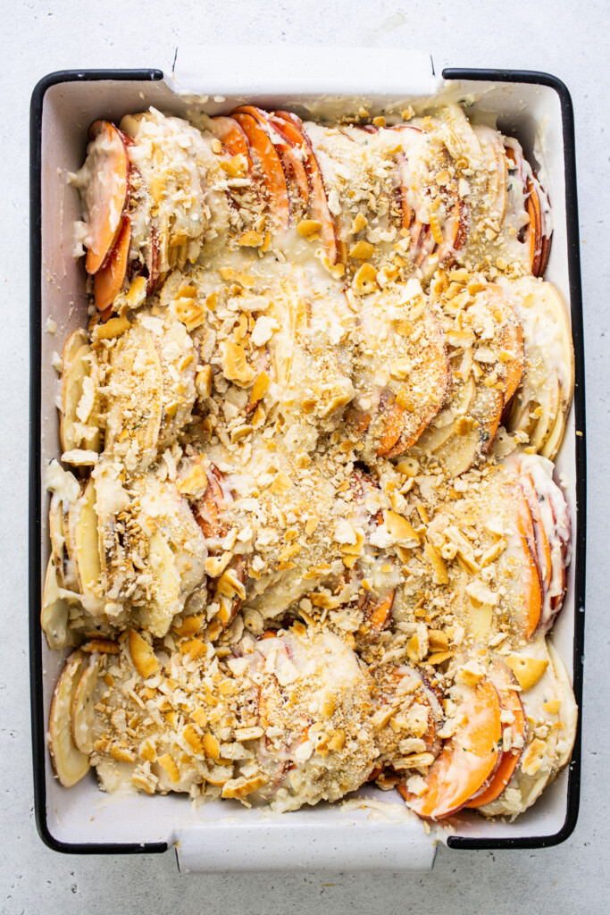 A baking dish filled with fruit and nuts.