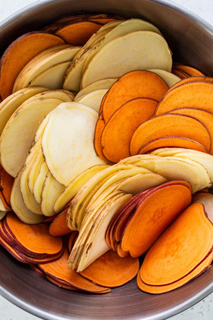 A bowl full of sweet potato slices.