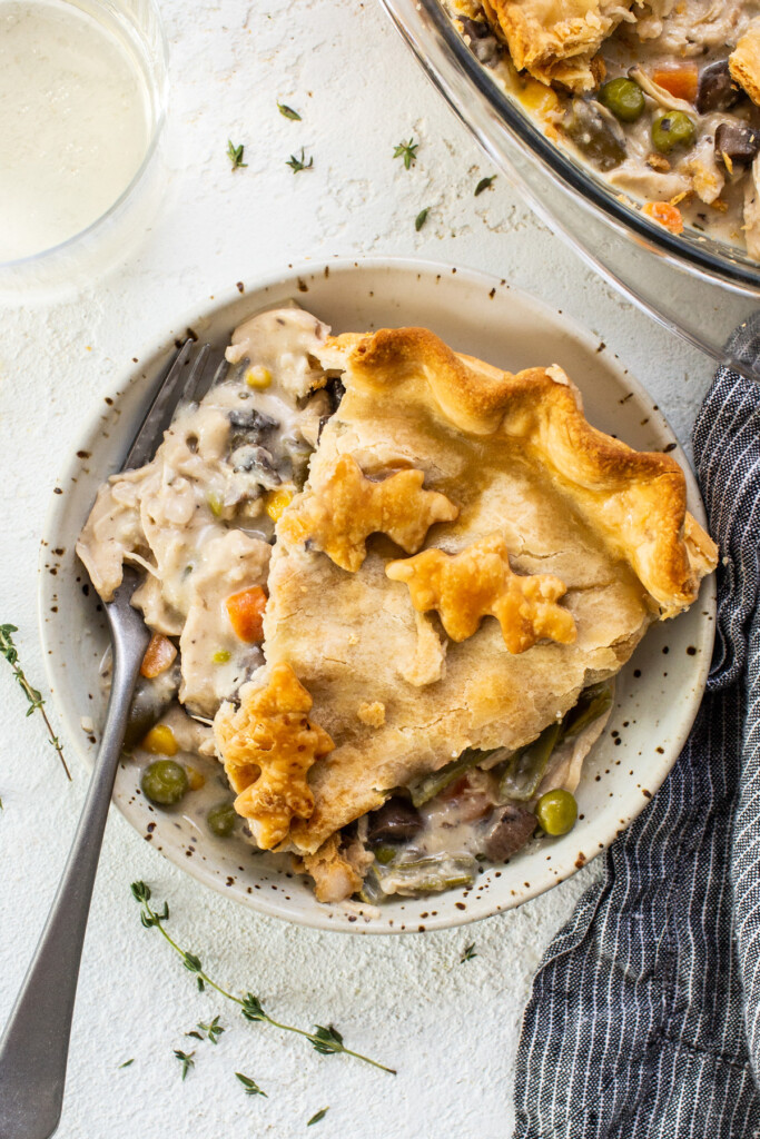 A slice of chicken pot pie on a plate.