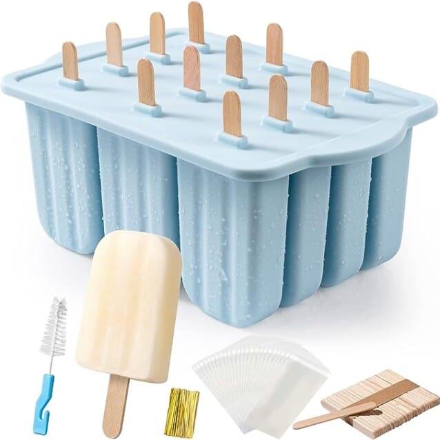 A blue box with ice pops, popsicle sticks and a spatula.