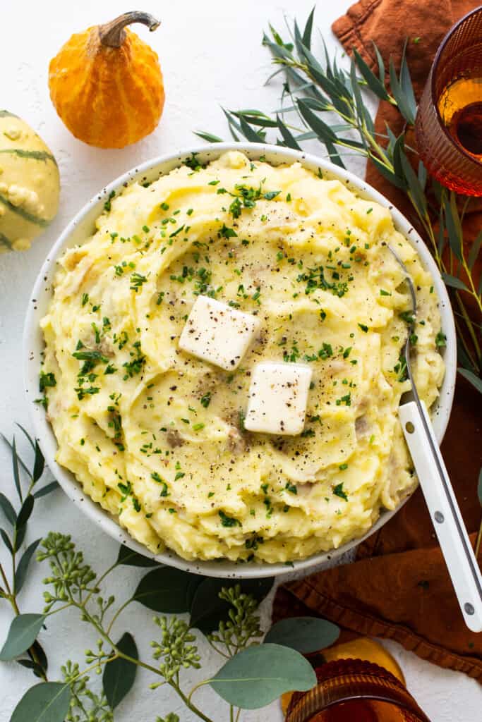 A bowl of mashed potatoes with feta cheese.