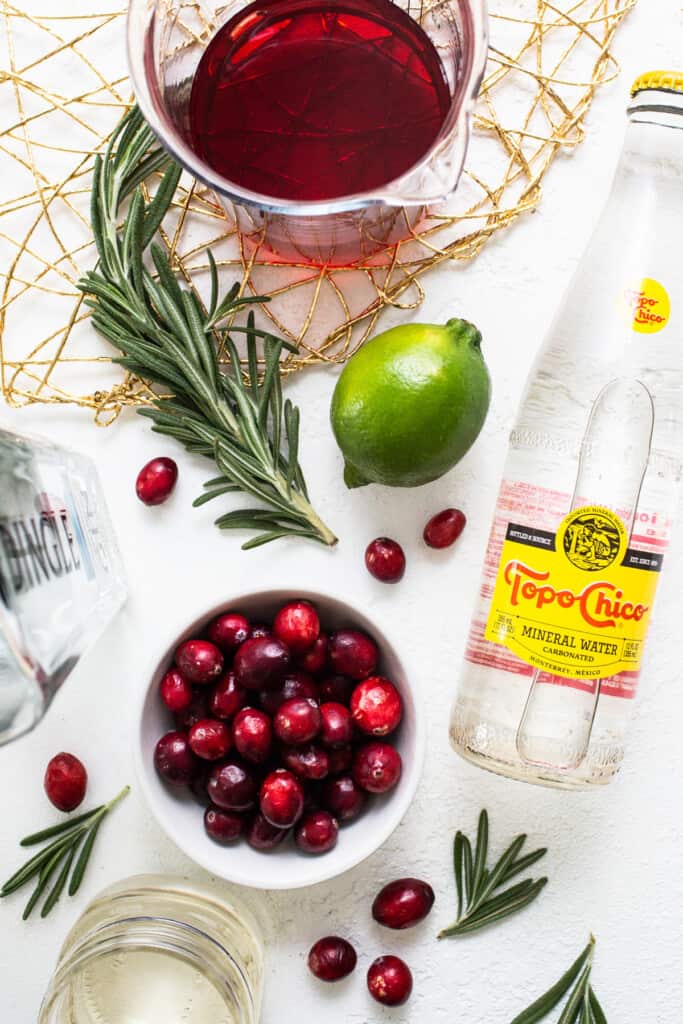 The ingredients for a cranberry gin cocktail.