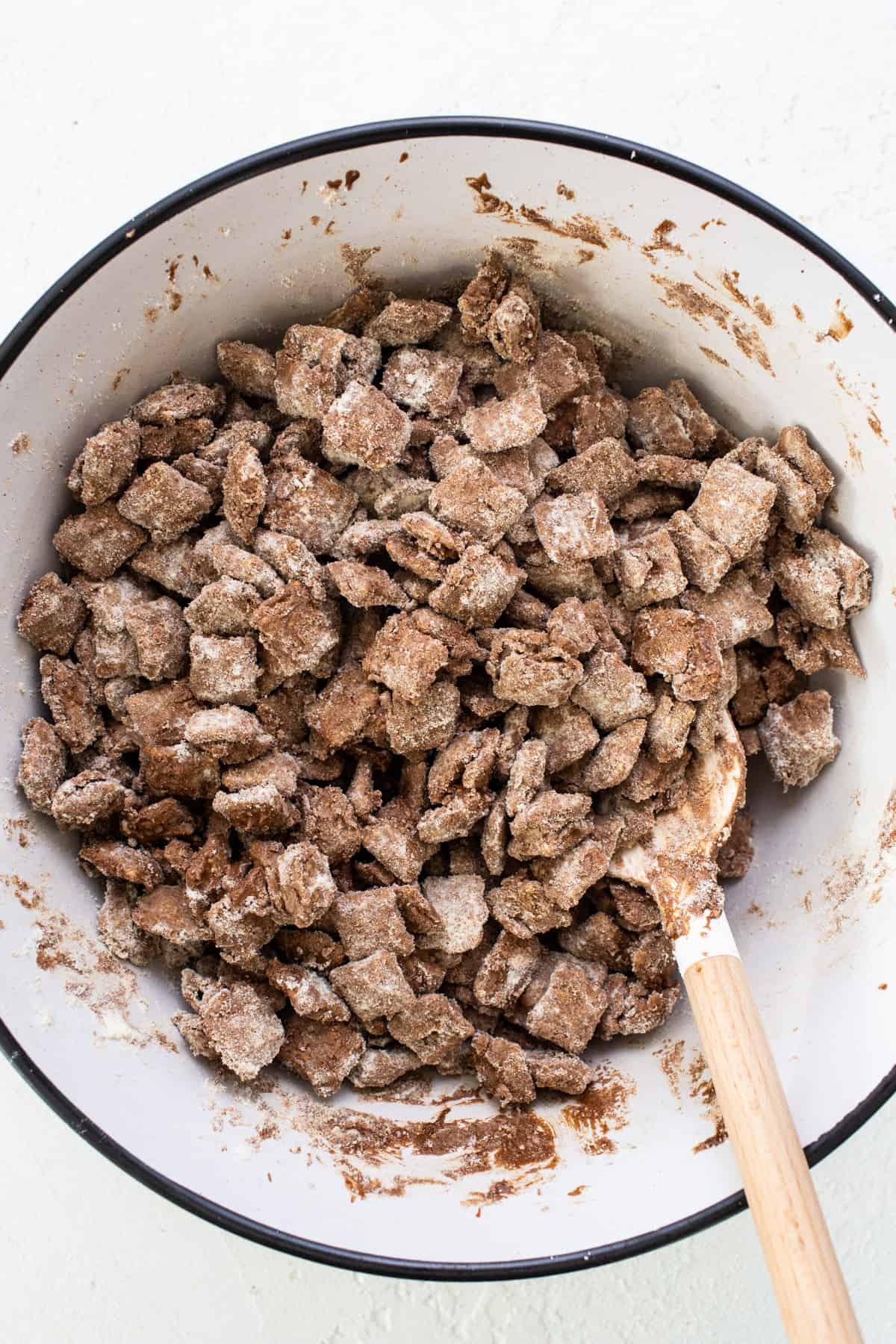 A bowl filled with a mixture of granola and chocolate chips.