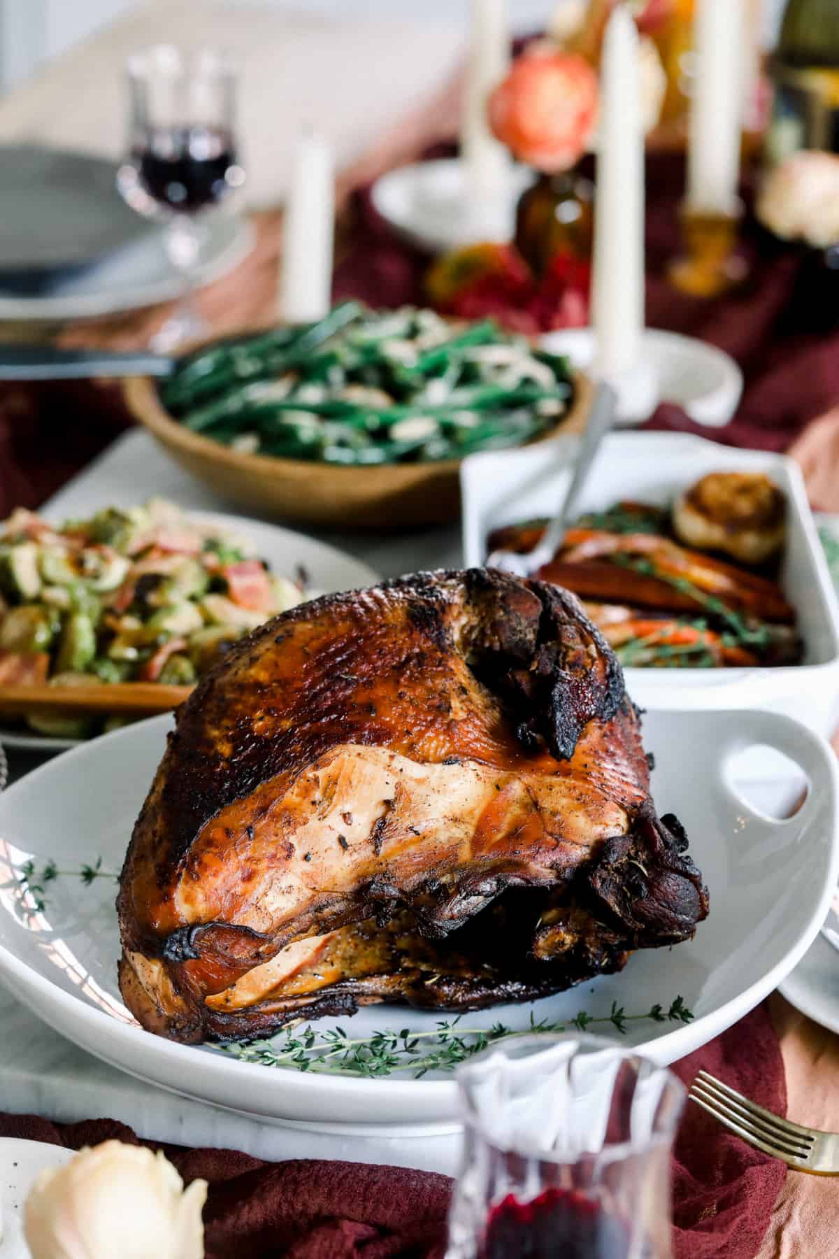 A table with a sous vide turkey and vegetables on it.