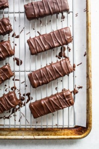 Chocolate bars on a cooling rack.