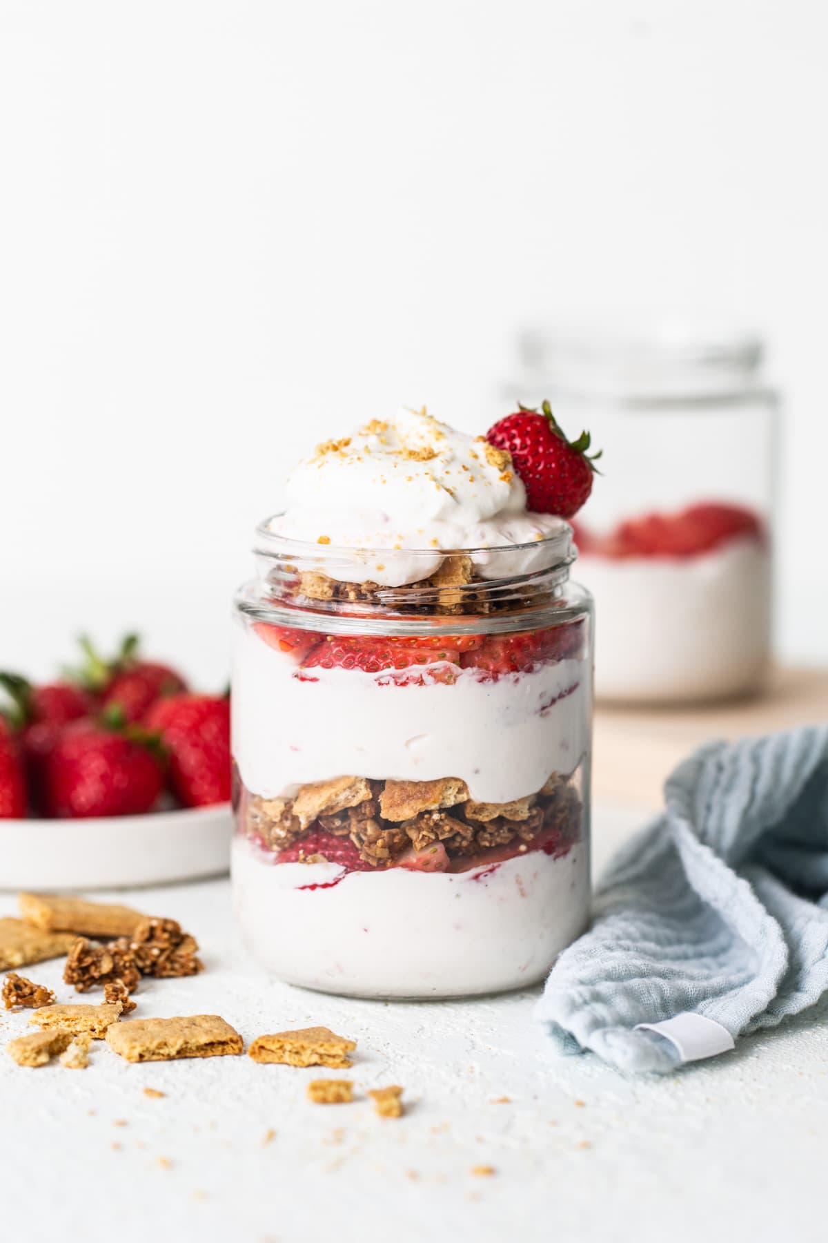 Strawberry granola parfait in a jar.