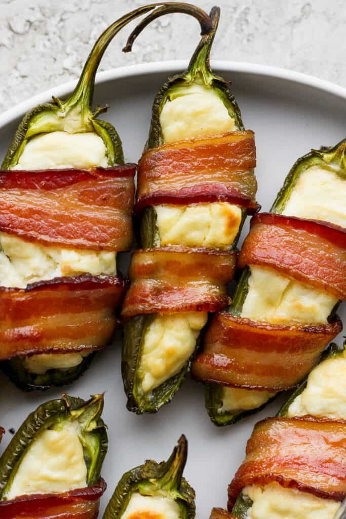 Jalapeno poppers served on a plate.