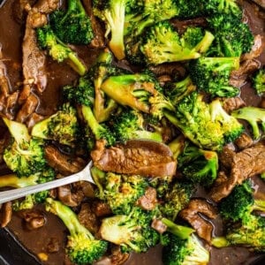 Beef and broccoli stir fry in a skillet.