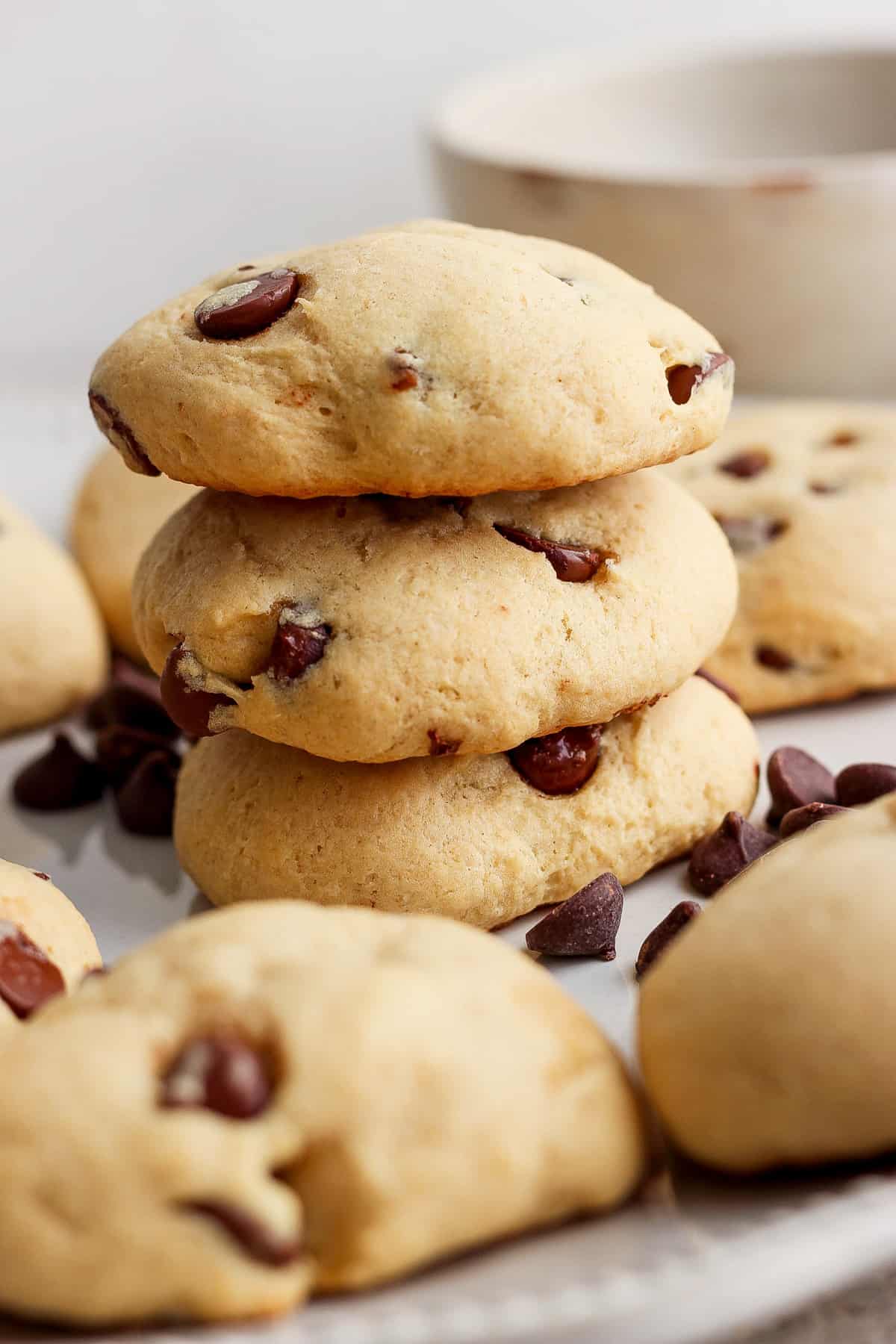 A stack of chocolate chip cookies on a plate.