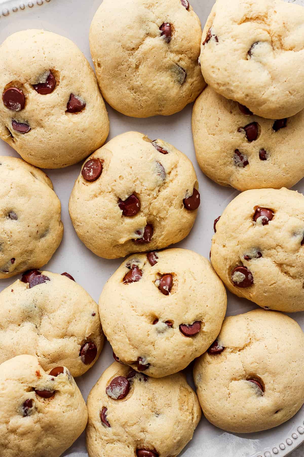 Cranberry chocolate chip cookies on a white plate.