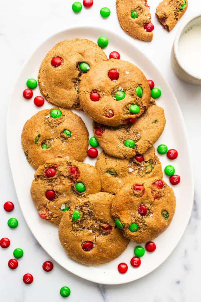 Christmas cookies on a plate with green and red m&ms.