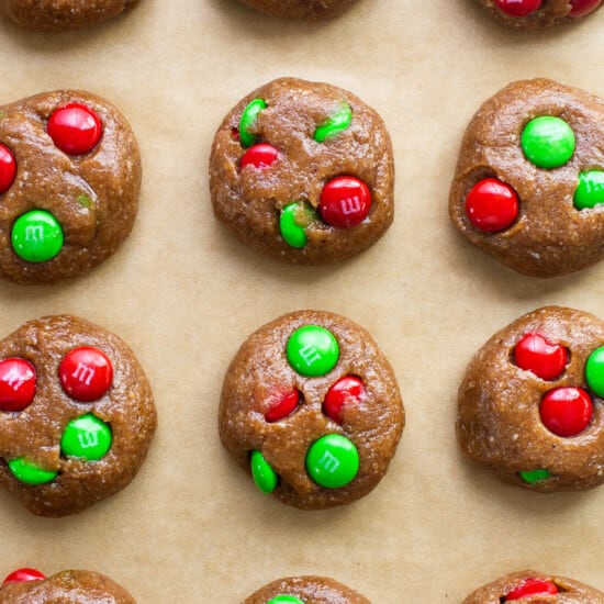 M & m cookies on a baking sheet with green and red m & m's.