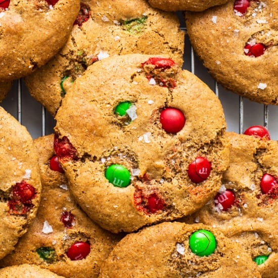 Christmas cookies with m&ms on a cooling rack.