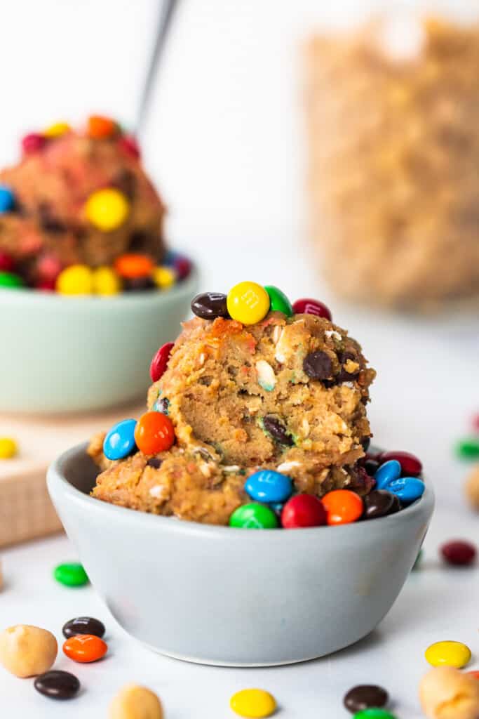 A bowl filled with cookies and m&m's.