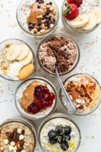 A bowl of oatmeal with berries, bananas, and granola.