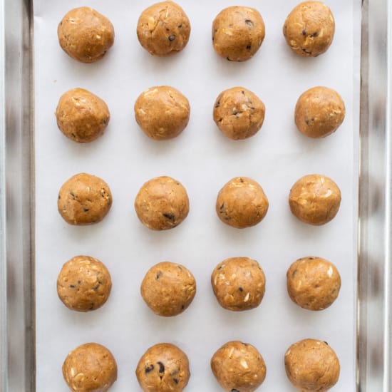 Peanut butter balls on a baking sheet.