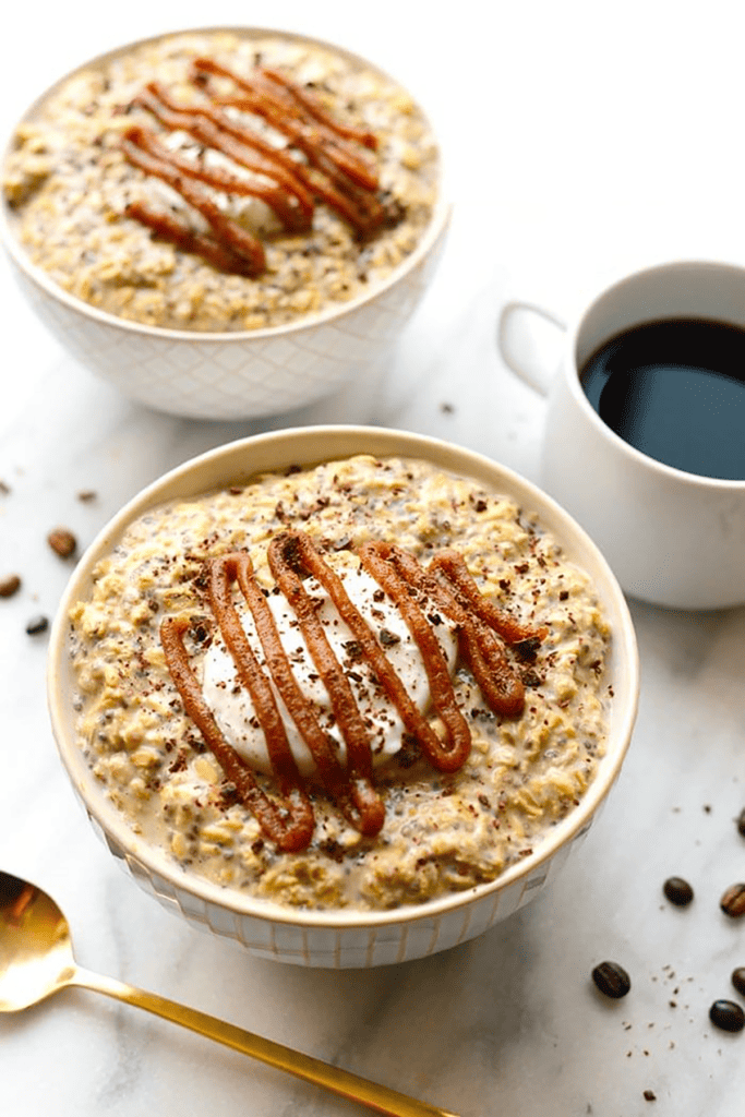 Two bowls of coffee overnight oats with caramel sauce.