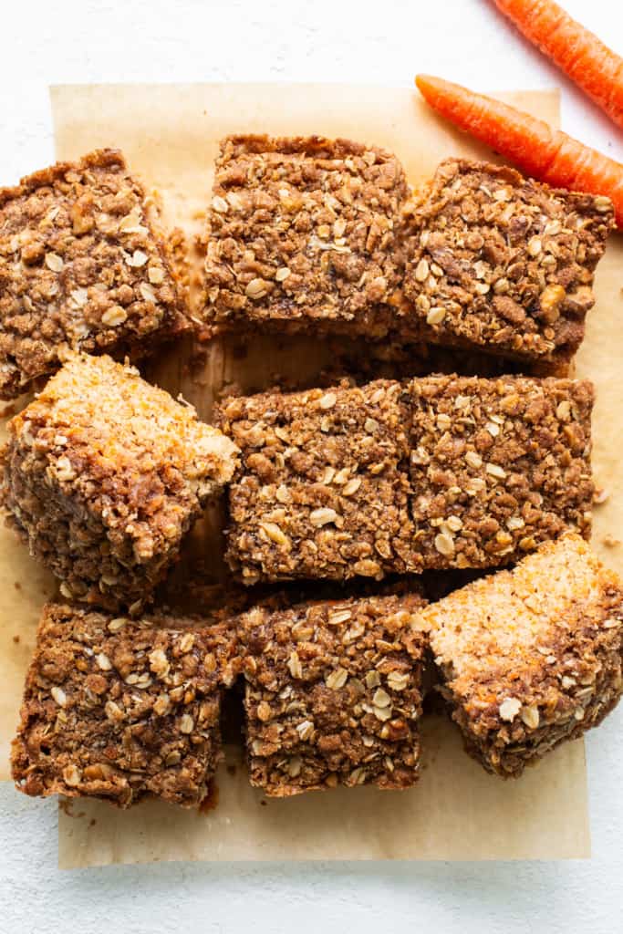 Carrot bars with oats and carrots on a cutting board.
