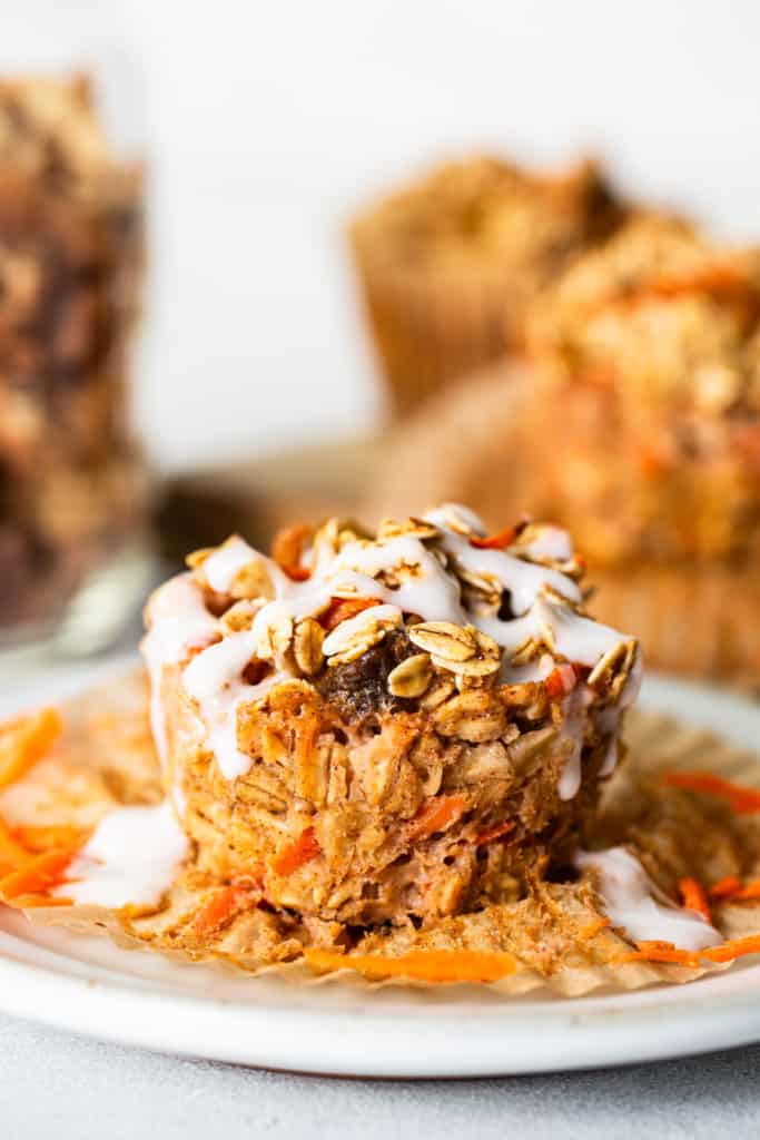 Carrot granola muffins on a white plate.