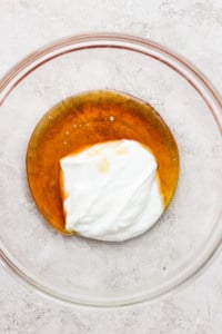 Whipped cream in a glass bowl.