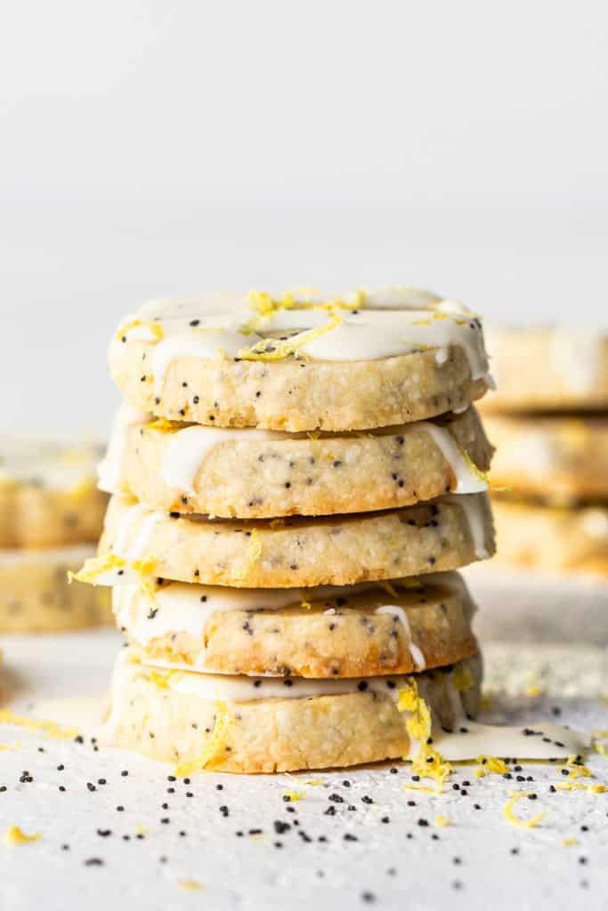 A stack of cookies with white frosting.