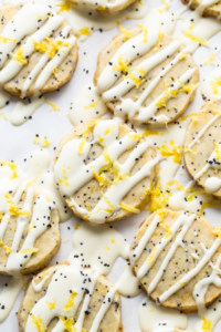 Lemon poppy seed cookies with icing and sprinkles.