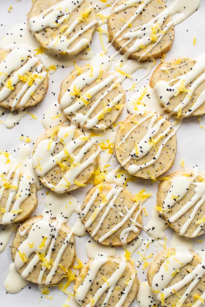 A group of cookies with white frosting.