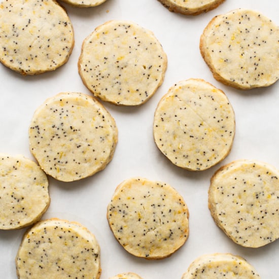 Lemon poppy seed cookies on a baking sheet.