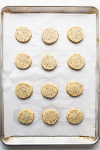 Lemon poppy seed cookies on a baking sheet.