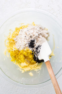 A bowl of ingredients with a wooden spoon in it.