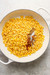 Corn on the cob in a white pan.