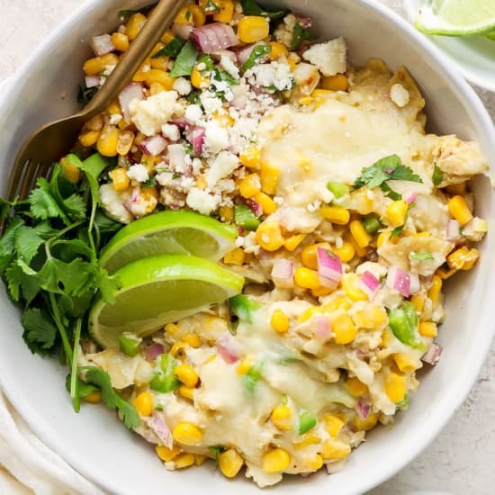Mexican corn and chicken casserole in a white bowl.