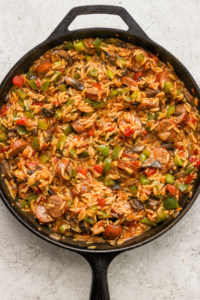 A skillet filled with rice and vegetables.