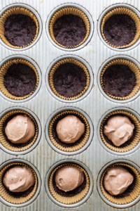 Chocolate cupcakes in a muffin tin.