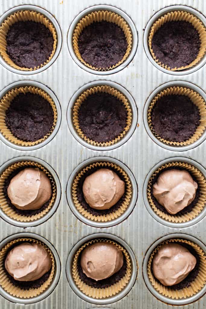 Chocolate cupcakes in a muffin tin.