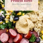 A nutritious protein bowl featuring quinoa, sausage, hummus, and mixed vegetables, labeled as a "brat protein bowl.