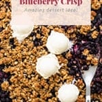Homemade blueberry crisp with oat topping served with vanilla ice cream in a sheet pan.