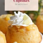 Image of pineapple cupcakes topped with whipped cream and pineapple chunks, with text "pineapple cupcakes - so delicious!" displayed above.