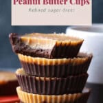 Stack of refined sugar-free Healthy Peanut Butter Cups with a bite taken out of the top one, showcasing their deliciousness.