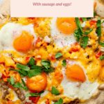 Breakfast galette topped with eggs, sausage, cheese, and herbs on a light-colored surface. Text above reads: "Breakfast Galette with sausage and eggs!.