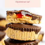 Stack of PB&J protein cups with chocolate coating and peanut topping, reminiscent of comforting oat cups. Text reads "PB&J Protein Cups, 10g protein per cup!.