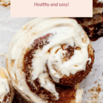 Close-up of frosted cinnamon rolls with a text overlay saying "Protein Cinnamon Rolls: Healthy and easy!.