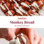 Close-up of monkey bread drizzled with icing. One piece is being held, showing its cinnamon-coated surface. Text reads: "Protein Monkey Bread - So yummy and easy!.