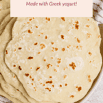 A plate of homemade tortillas sits on a striped cloth. A label above reads, “Protein Tortillas—Made with Greek yogurt!”.