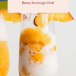 A glass of frozen peach-colored beverage garnished with peach slices, labeled as “Frozen Beach Billini: Boozy beverage idea!”.